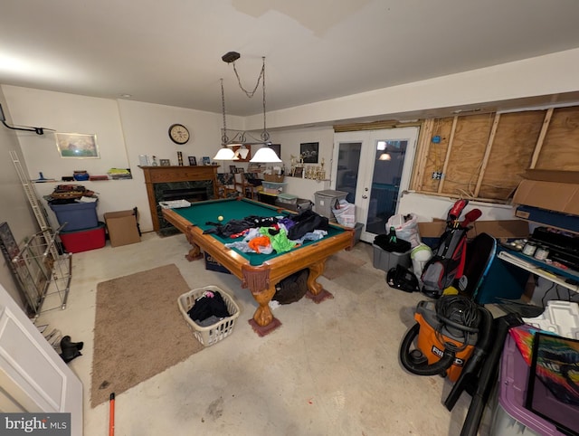 recreation room with billiards, a high end fireplace, and french doors