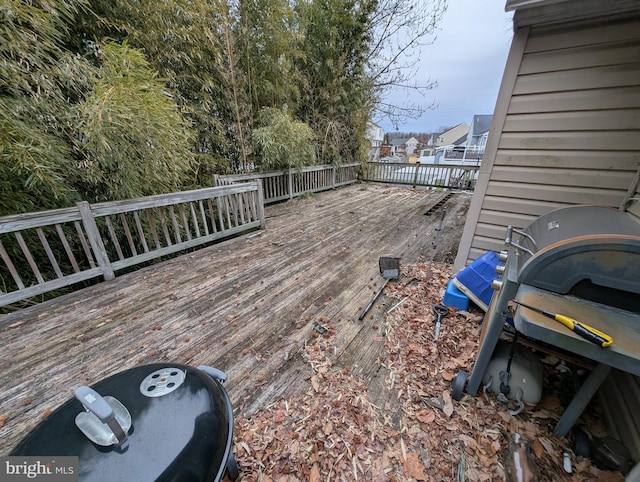 wooden terrace with area for grilling