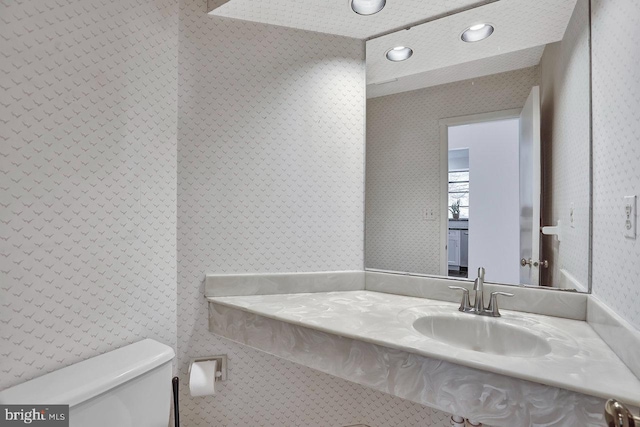 bathroom featuring sink and toilet