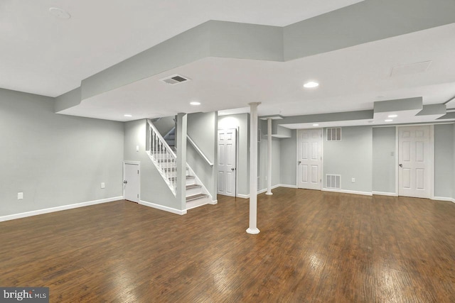 basement featuring dark hardwood / wood-style flooring