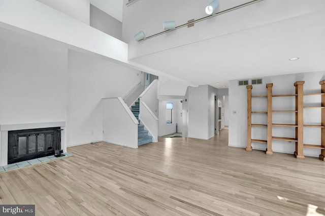 unfurnished living room featuring light hardwood / wood-style floors