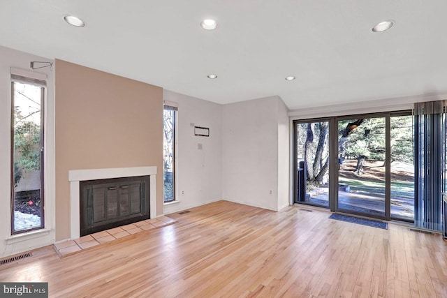 unfurnished living room with light hardwood / wood-style flooring