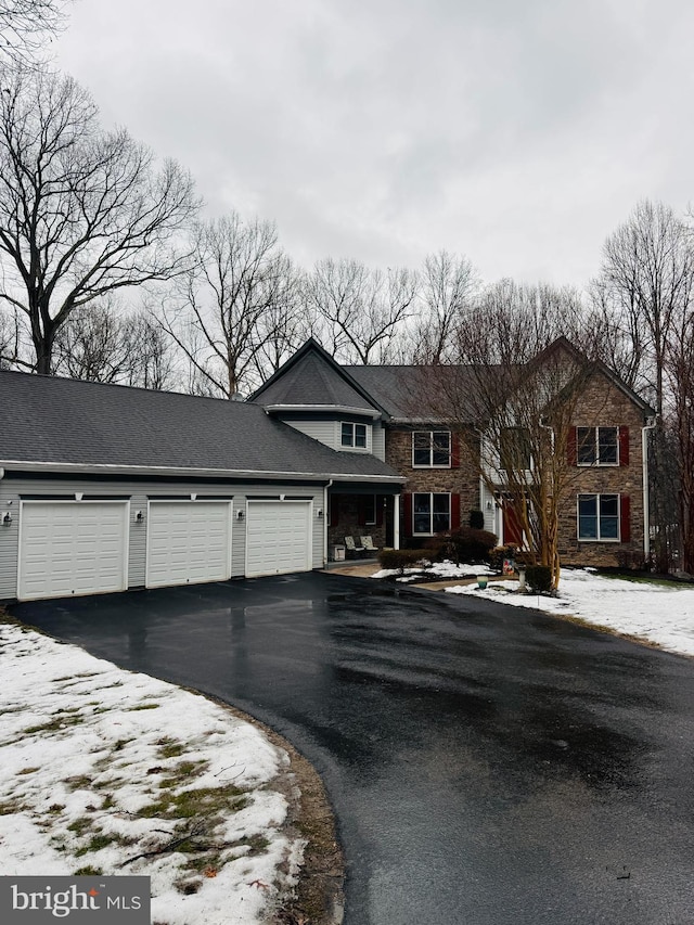 view of front of home with aphalt driveway