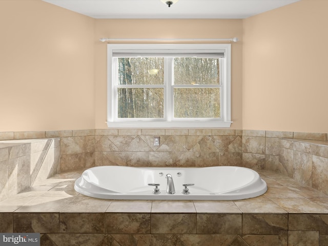 full bathroom featuring tiled tub