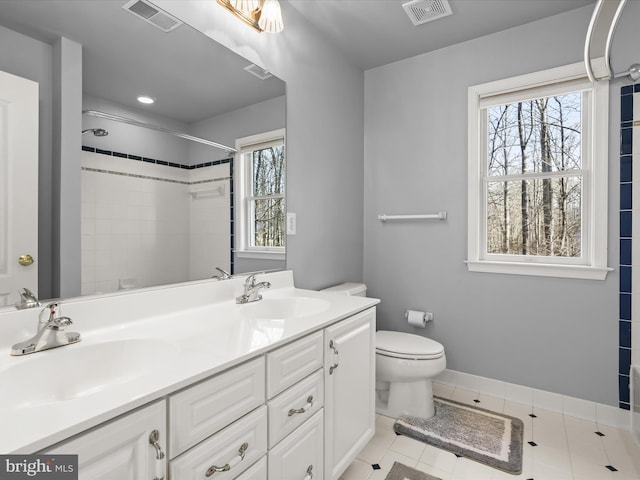 full bathroom with double vanity, visible vents, and a sink