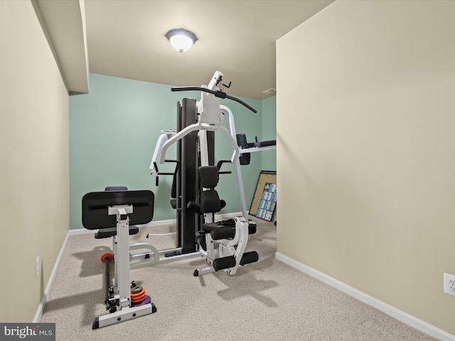 workout room with baseboards