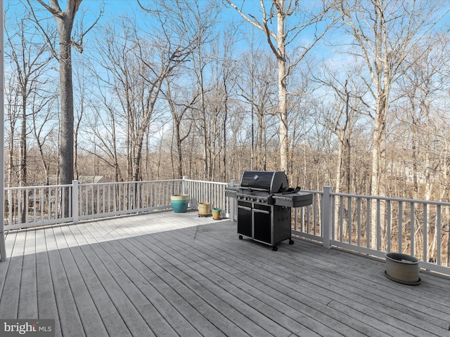 wooden deck featuring area for grilling