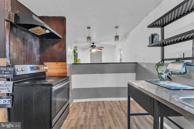 kitchen with stainless steel electric range, ceiling fan, range hood, dark brown cabinetry, and light wood-type flooring