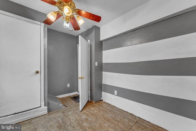 unfurnished bedroom featuring ceiling fan