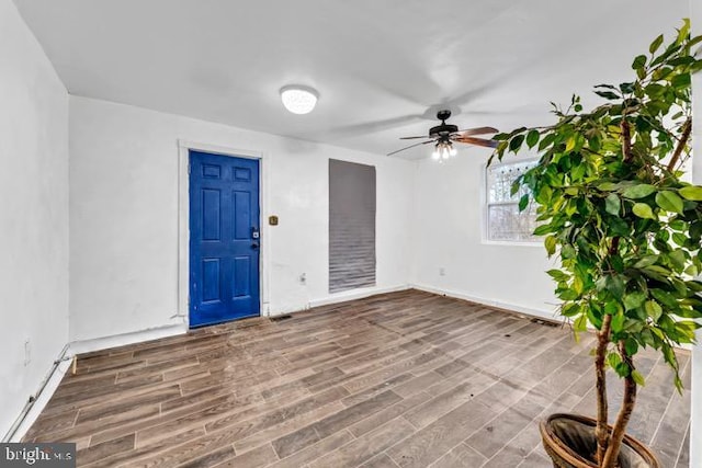 empty room featuring wood-type flooring and ceiling fan