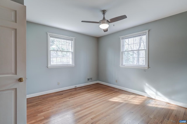 spare room with ceiling fan and light hardwood / wood-style flooring