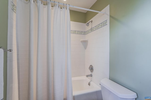 bathroom featuring toilet and shower / bath combo