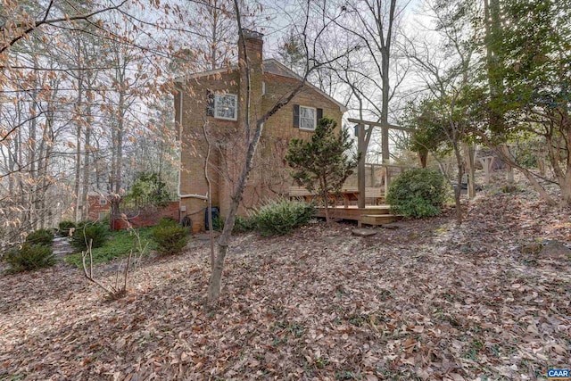 view of side of home featuring a deck