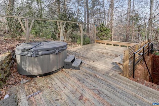 wooden terrace with a hot tub