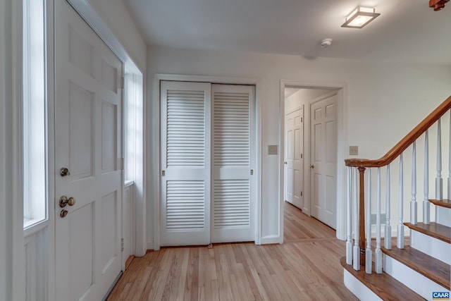 foyer entrance with light hardwood / wood-style flooring