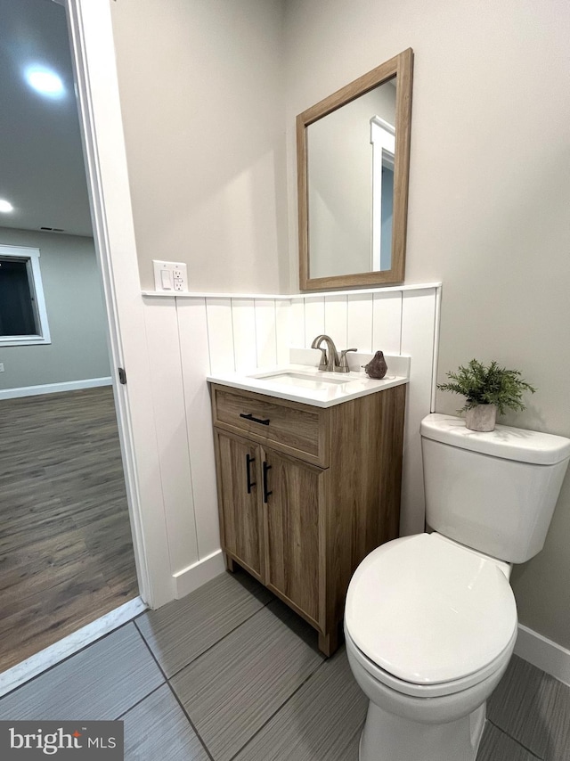 bathroom with vanity and toilet