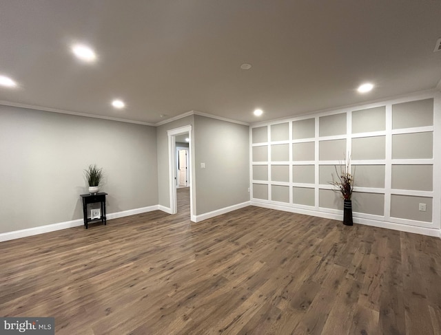 unfurnished room with dark hardwood / wood-style flooring and crown molding