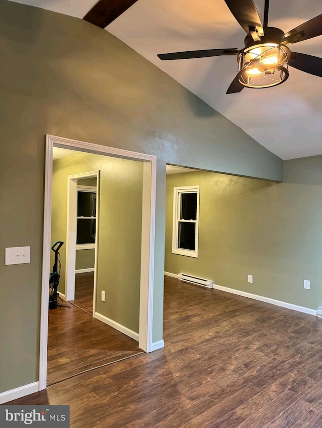 interior space with dark wood-type flooring, vaulted ceiling, ceiling fan, and baseboard heating