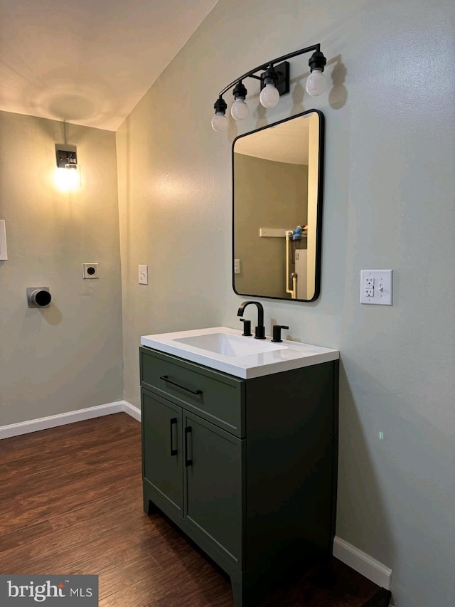 bathroom featuring vanity and hardwood / wood-style flooring