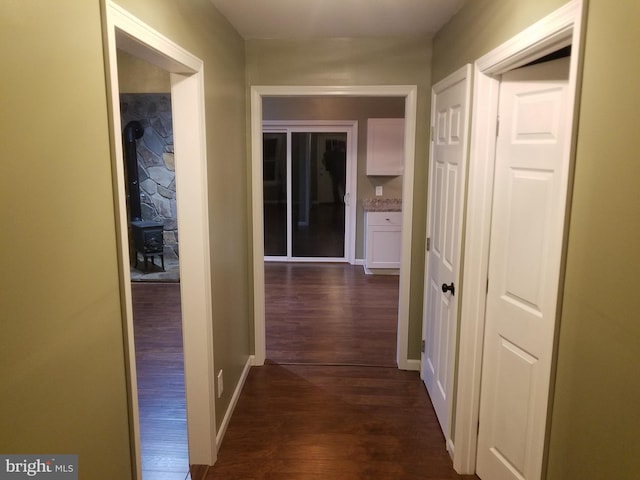 hallway with dark wood-type flooring