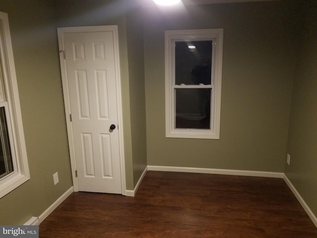 interior space with dark hardwood / wood-style flooring