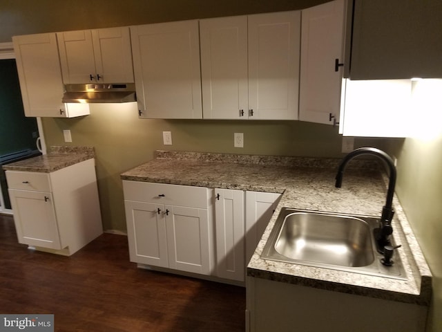 kitchen featuring white cabinetry, sink, and dark hardwood / wood-style floors