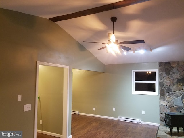 interior space with ceiling fan, a wood stove, hardwood / wood-style floors, and baseboard heating