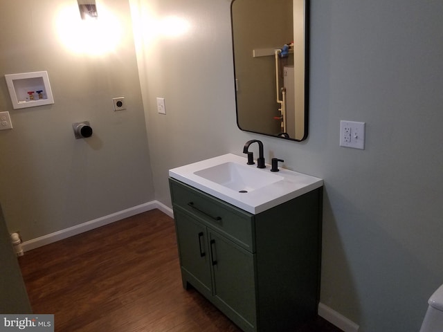 bathroom featuring wood-type flooring and vanity