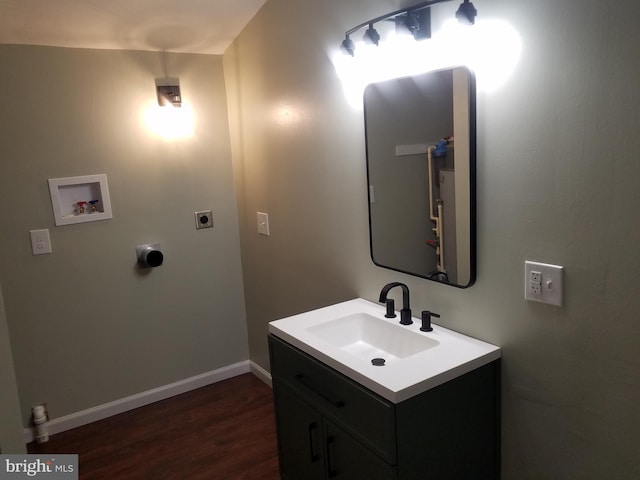 bathroom featuring hardwood / wood-style flooring and vanity