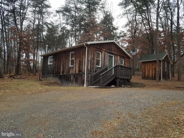 exterior space featuring a storage shed