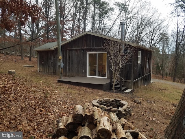 view of outdoor structure with a fire pit