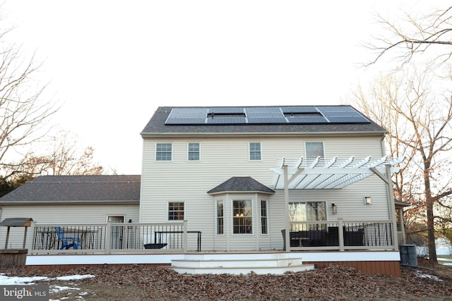 2477 Meade Dr, Vineland, NJ 08361 - rear view of house with solar panels, a deck, and a pergola