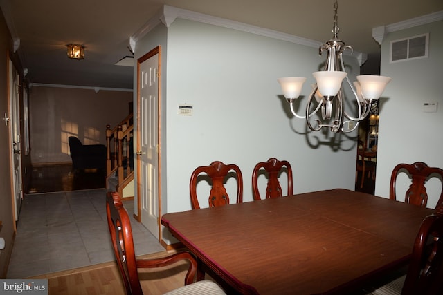 2477 Meade Dr, Vineland, NJ 08361 - dining space with an inviting chandelier, tile patterned floors, and ornamental molding