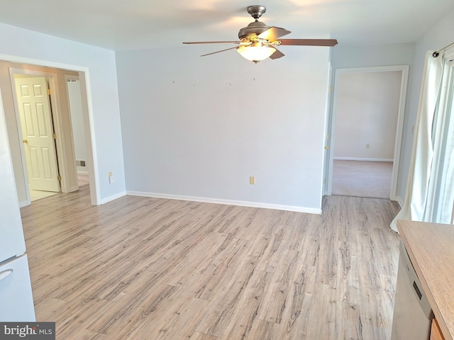 empty room with ceiling fan and light wood-type flooring