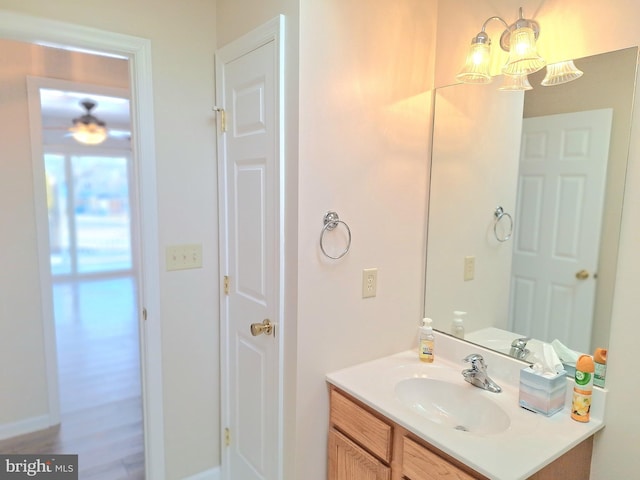 bathroom featuring vanity and an inviting chandelier