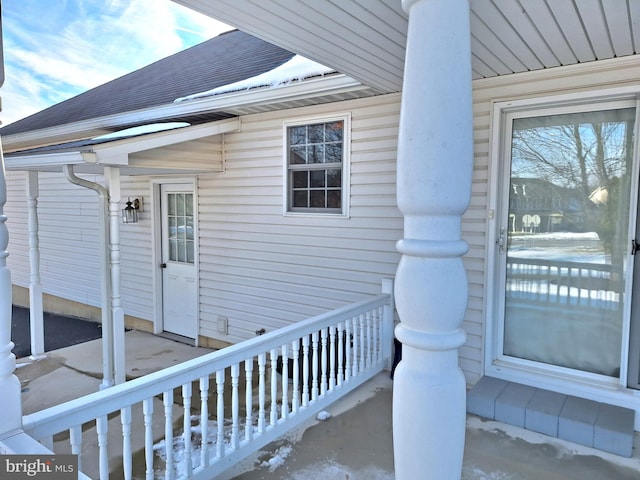 view of snow covered property entrance