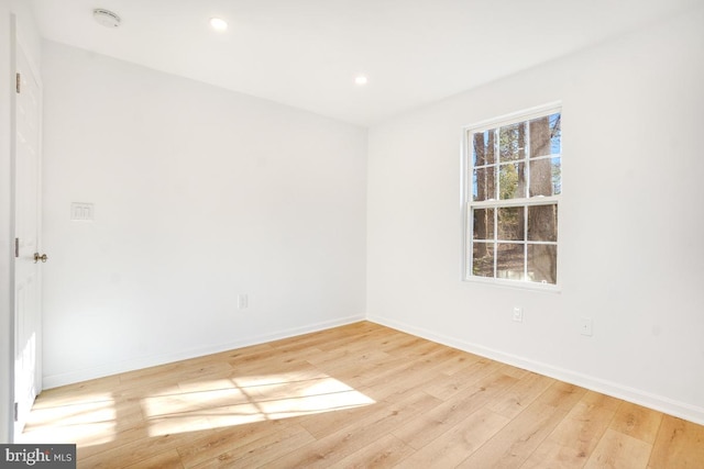 unfurnished room with light hardwood / wood-style floors