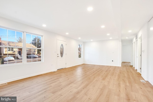 unfurnished living room featuring light hardwood / wood-style flooring