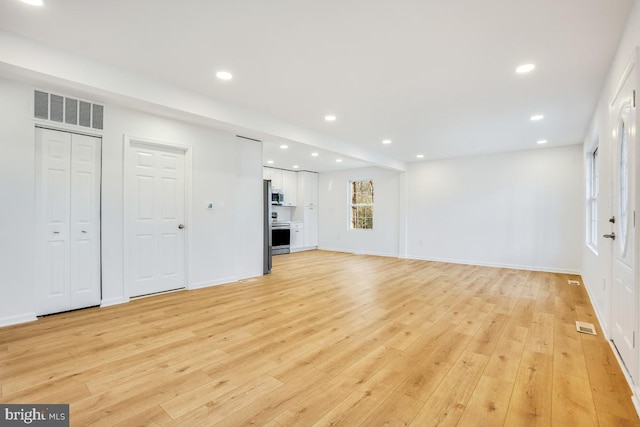 unfurnished living room with light hardwood / wood-style floors