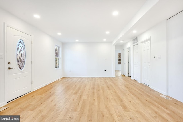 foyer with light hardwood / wood-style floors