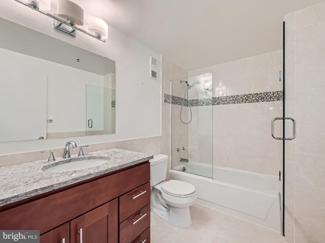 full bathroom with enclosed tub / shower combo, vanity, toilet, and tile patterned floors