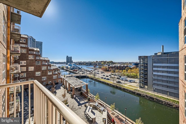 balcony featuring a water view