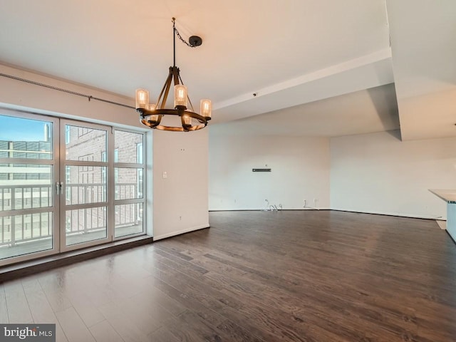 interior space featuring an inviting chandelier and dark hardwood / wood-style flooring