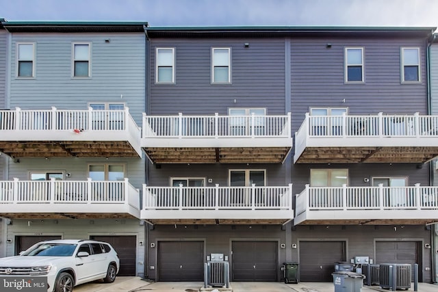 rear view of property with cooling unit