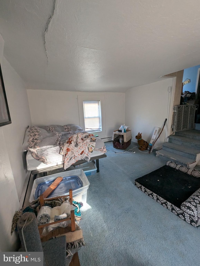 interior space with a baseboard radiator and a textured ceiling