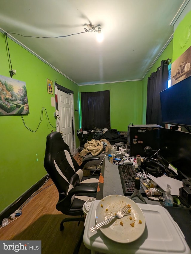 office with hardwood / wood-style flooring and ornamental molding