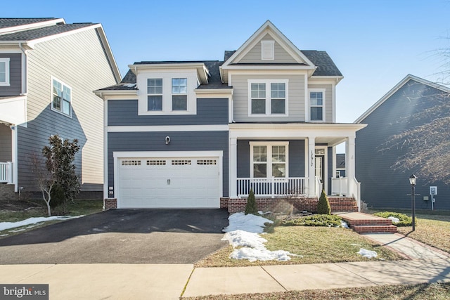 view of front of house with a garage and a porch