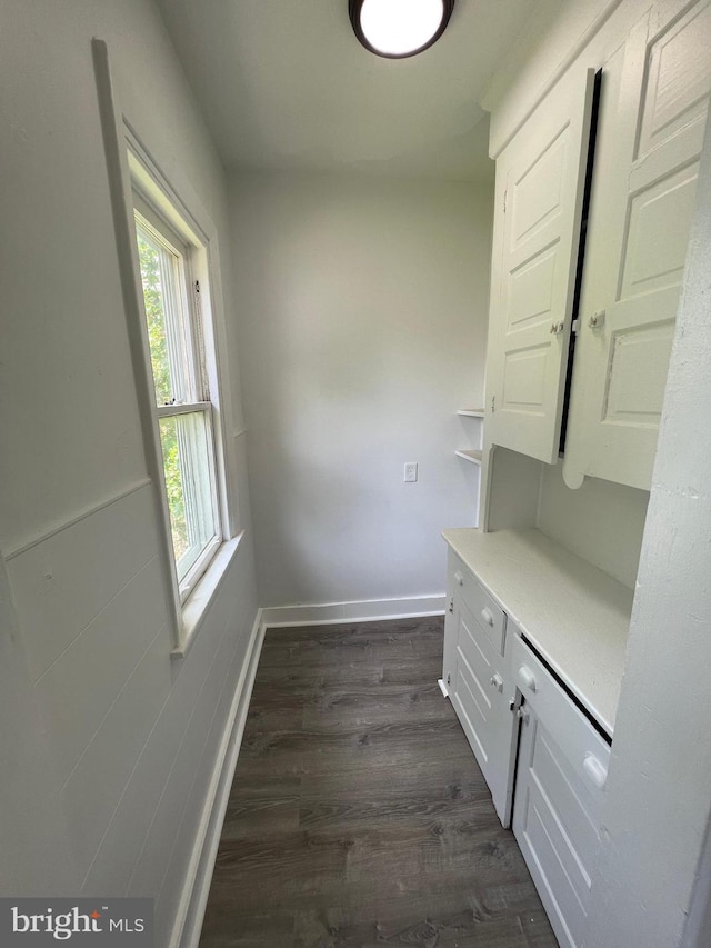 interior space with dark hardwood / wood-style flooring