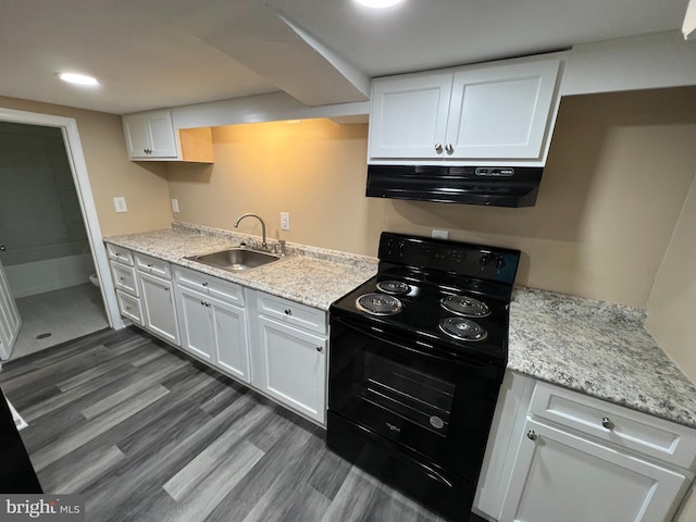 kitchen featuring white cabinetry, black electric range, sink, and dark hardwood / wood-style floors