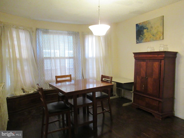 dining area with dark wood-type flooring